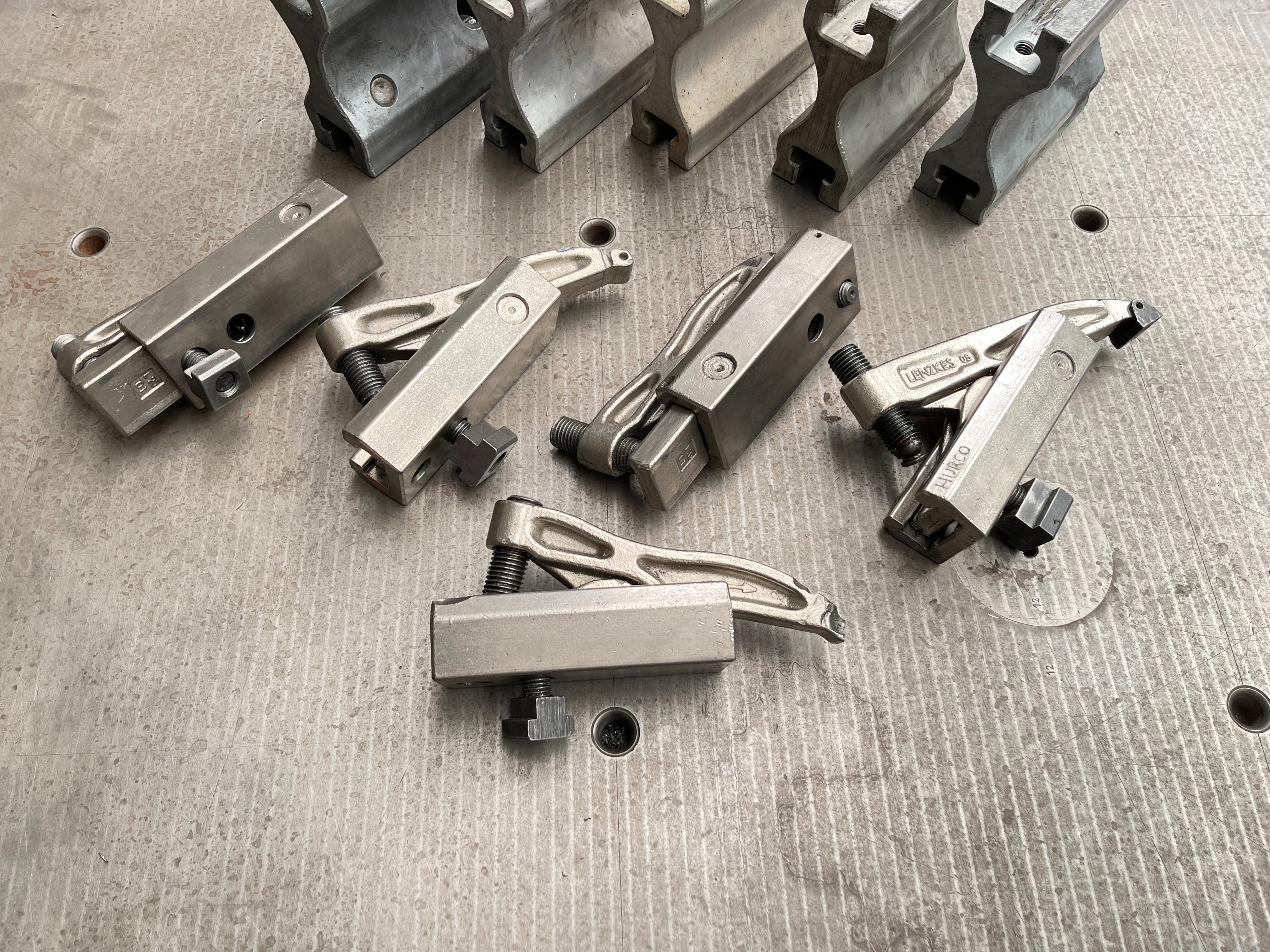 Qty of Lenzkes Clamps and Riser Blocks