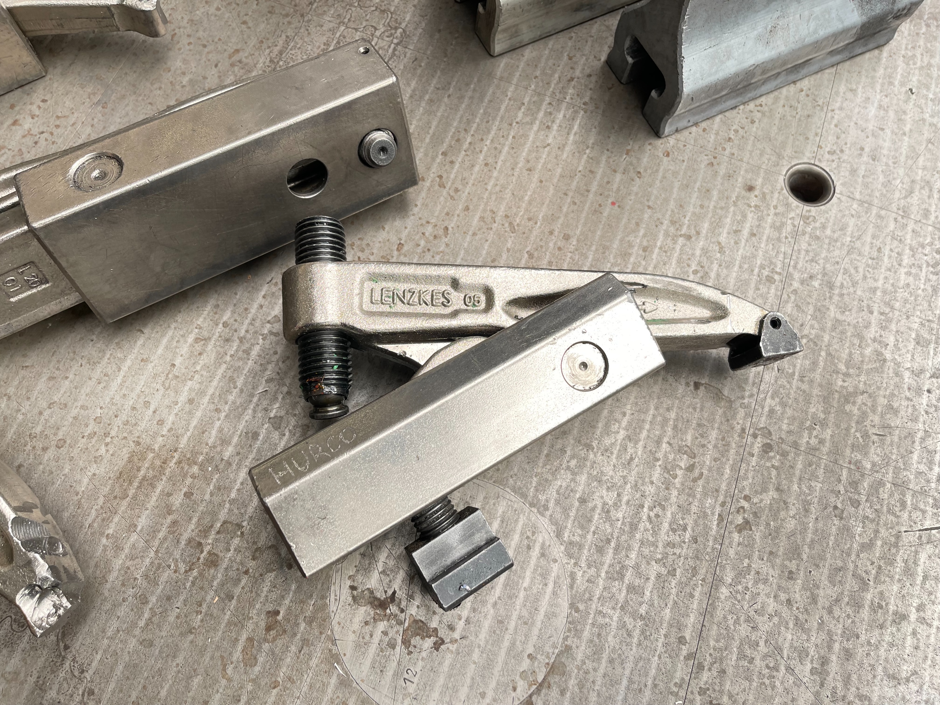 Qty of Lenzkes Clamps and Riser Blocks