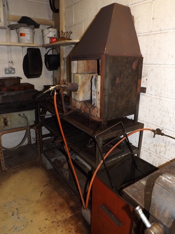 Blacksmiths Hearth with steel bench, quench bucket & tools